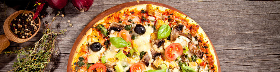 Pizza with olives, tomatoes, and basil