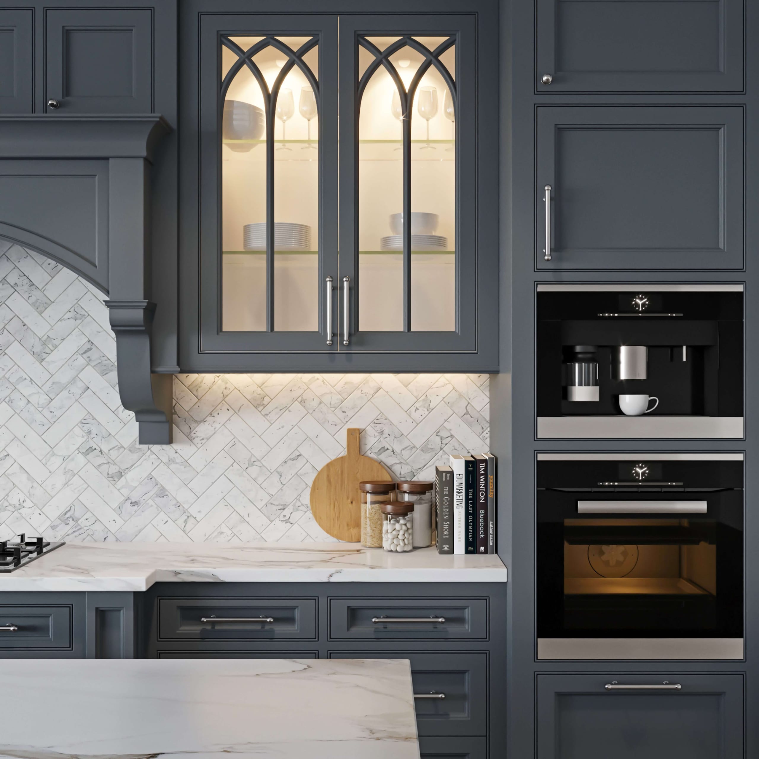 Gray kitchen cabinets with a marble herringbone backsplash