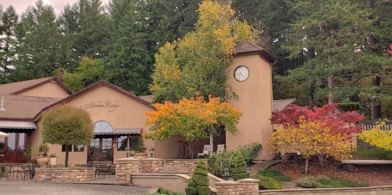 Silvan Ridge Winery building with a clock tower and fall trees